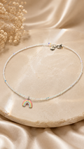 The Rainbow Jellycat Hand-Beaded Necklace with reflective white crystals