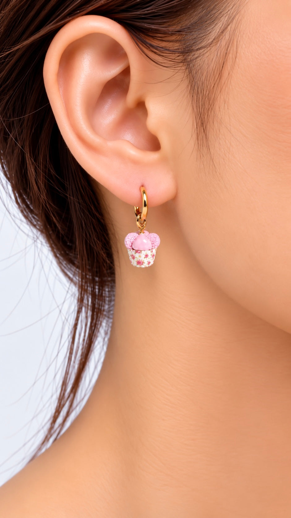 Huat kueh charm worn as a hoop earring accent