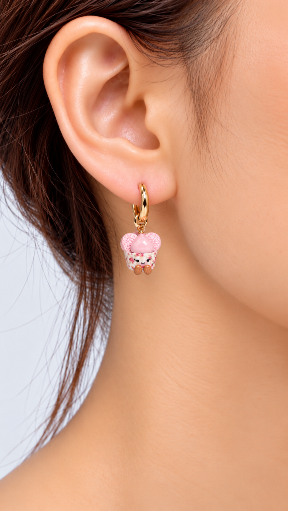 Model wearing smiley huat kueh cute food earrings