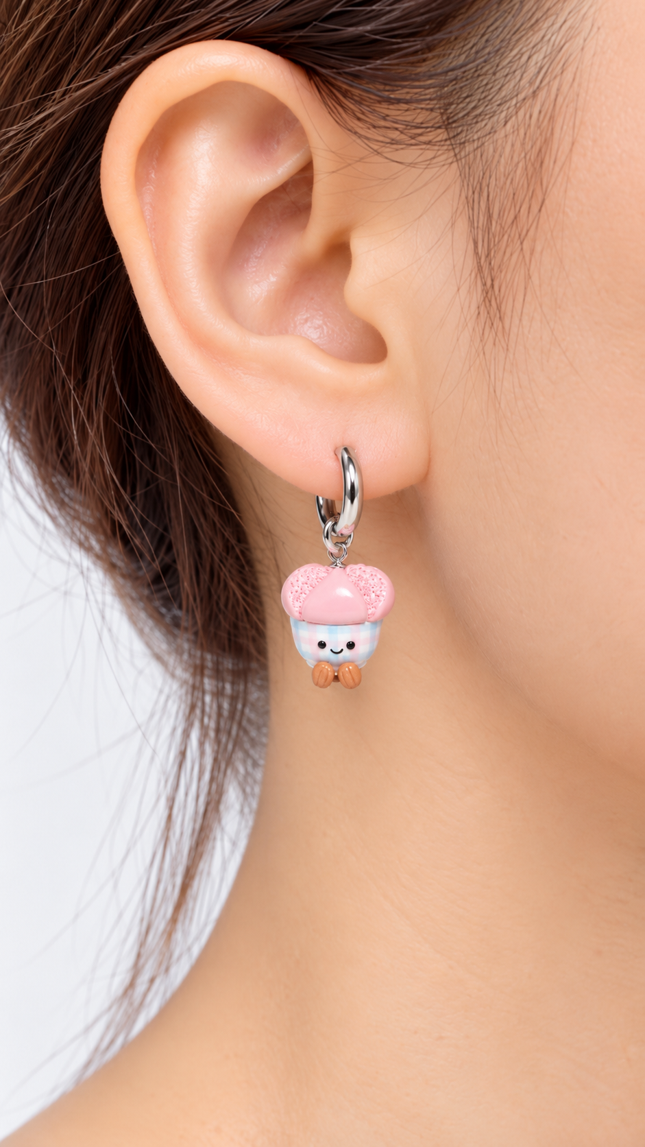 Model wearing smiley huat kueh gingham cute food earrings